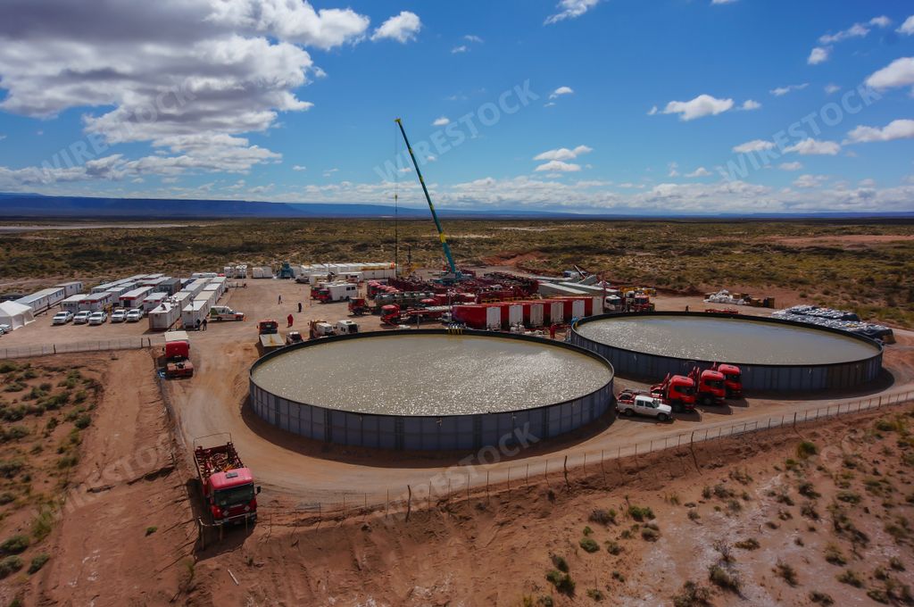 Extraction of unconventional oil. Battery of pumping trucks for hydraulic fracturing (Fracking).