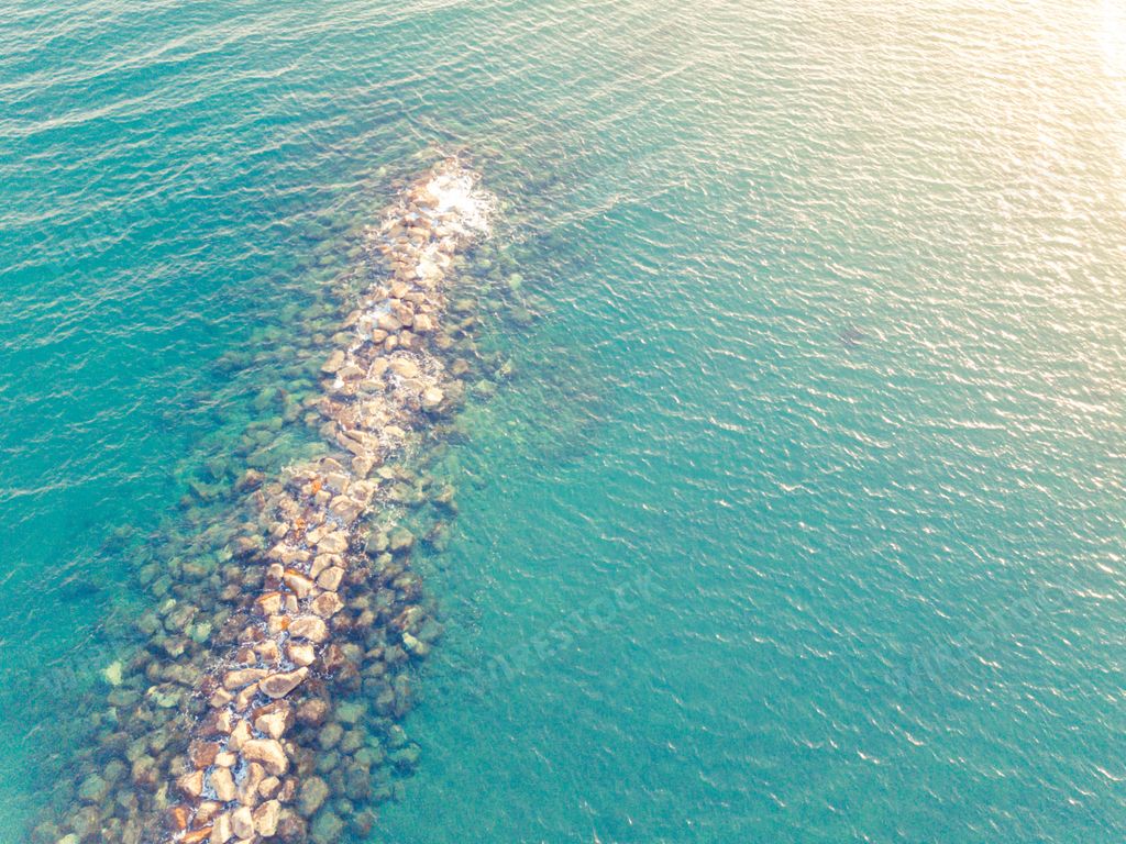 An aerial shot of an artificial reef close to the beach at Dasoudi park in Limassol, Cyprus