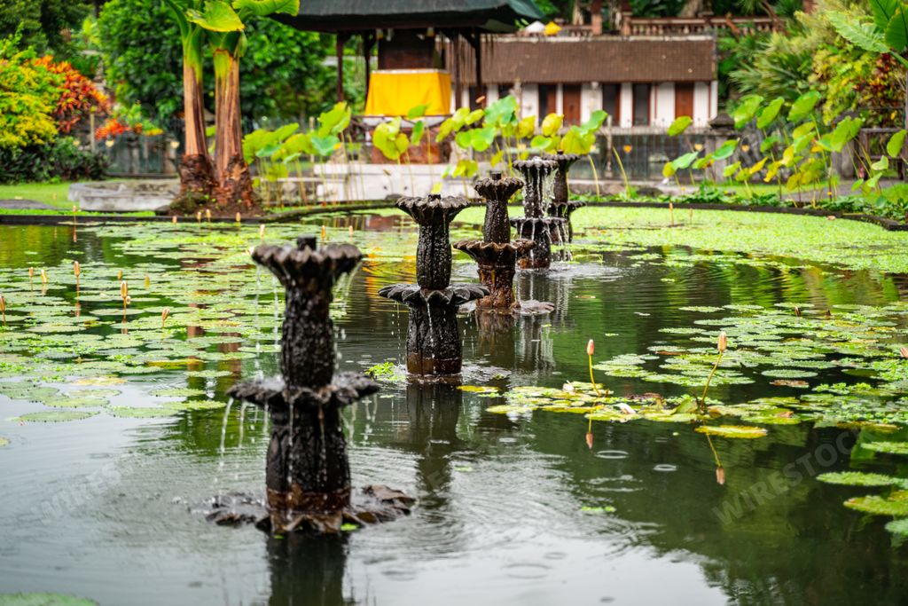 A beautiful Water Palace of Tirta Gangga with small fountains and water lilies in Karangasem, Indonesia