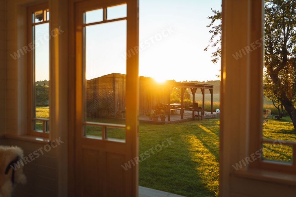 A golden sunrise view of the garden from the house