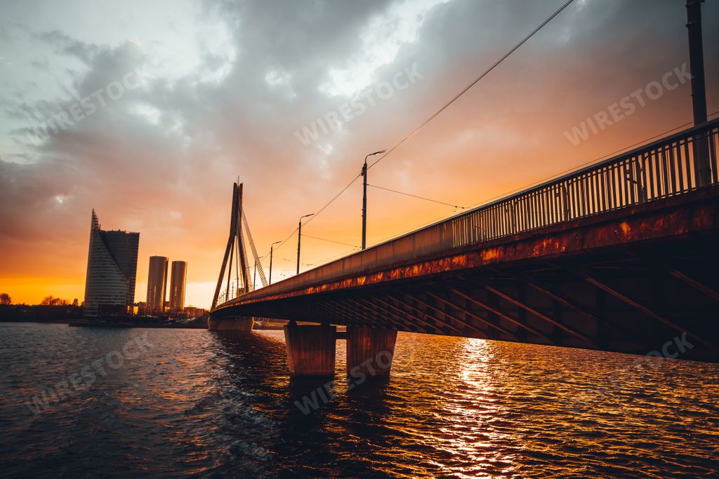 The beautiful view of the Vansu Bridge crossing the Daugava river at sunset. Riga, Latvia.