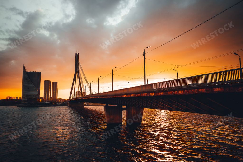The beautiful view of the Vansu Bridge crossing the Daugava river at sunset. Riga, Latvia.