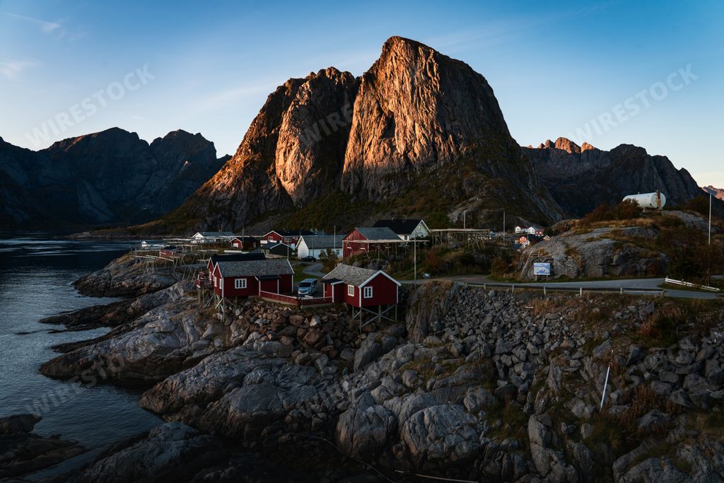 A breathtaking shot of the mountainous landscape with the ocean captured in Reine, Norway
