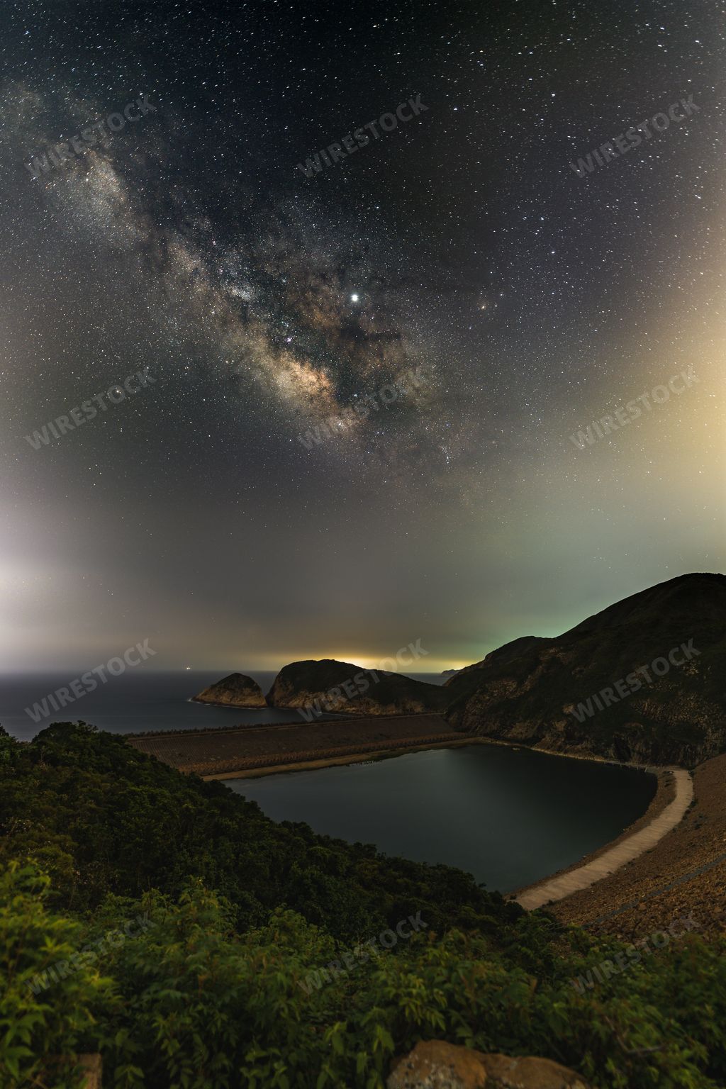 A beautiful scenery of Milky Way Galaxy in the night sky over a landscape in Hong Kong
