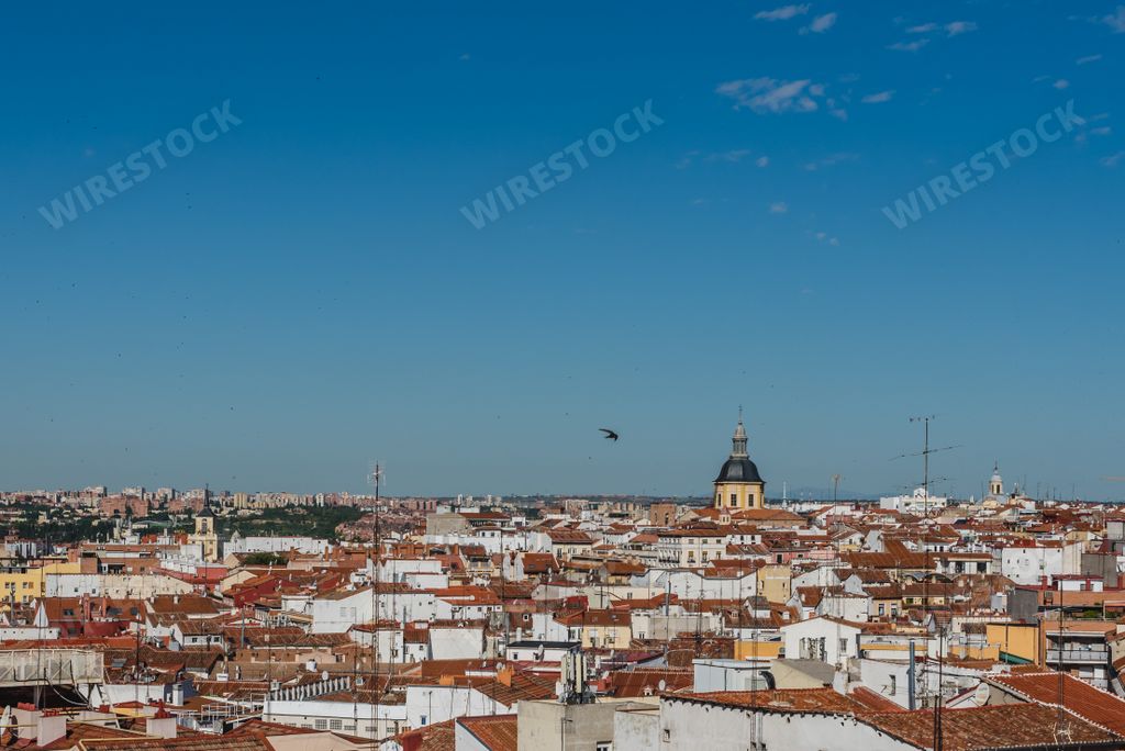 The beautiful white houses with red roof tiles gleaming under the blue sky
