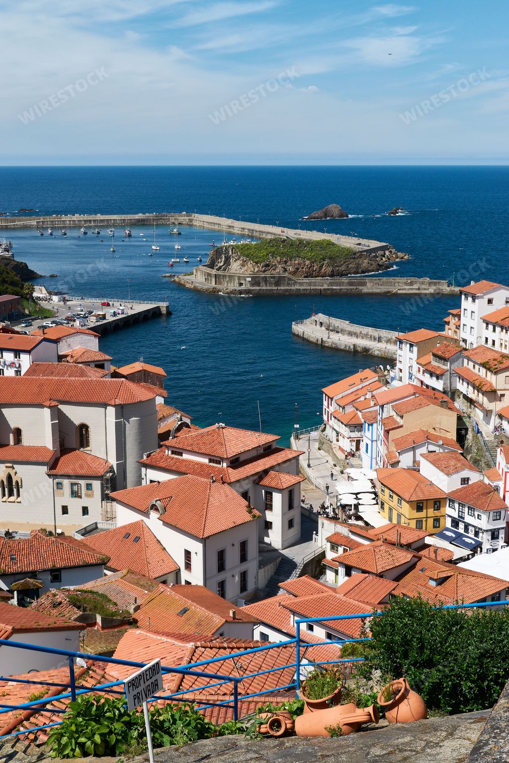 A vertical shot of coastal houses with red roof in Spain