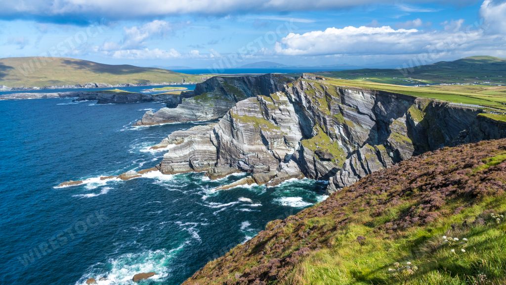 A beautiful scenery of a landscape with cliffs and the Atlantic ocean in Ireland