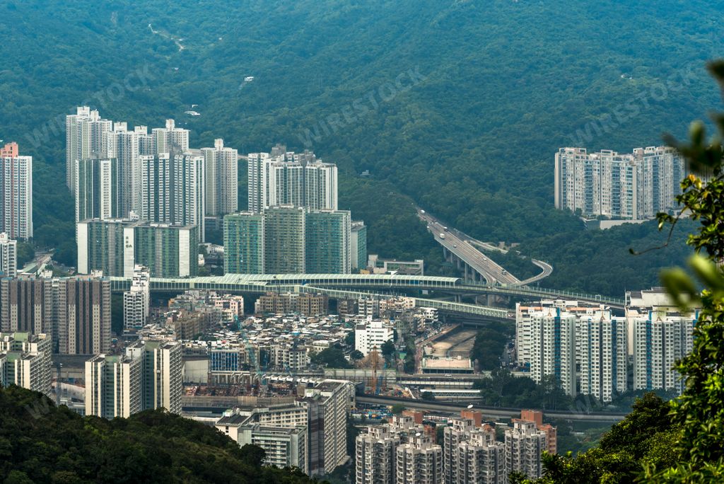 An aerial view of the skyline of the city of Hong Kong and mountains, China