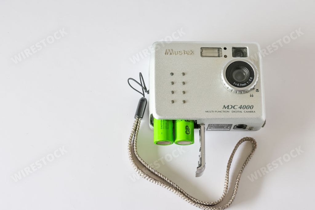 A closeup of the Mustek MDC 4000 4MP Digital Camera over a white background