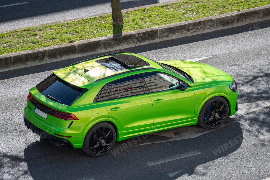 A green Audi RS Q8 luxurious sportscar