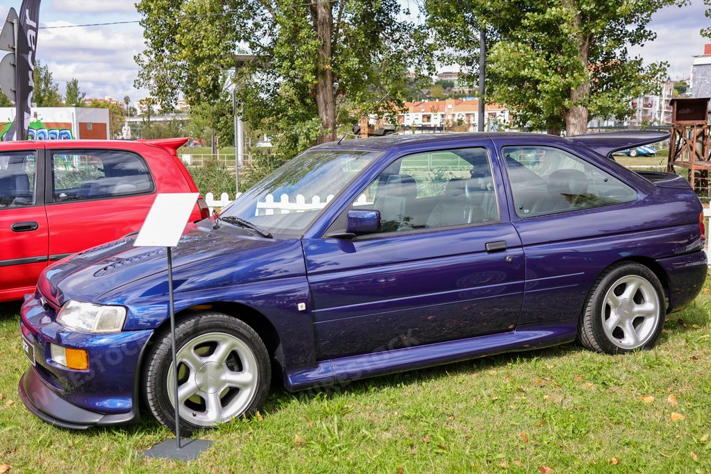 A closeup of details of blue vintage historic Ford Escort RS Cosworth car