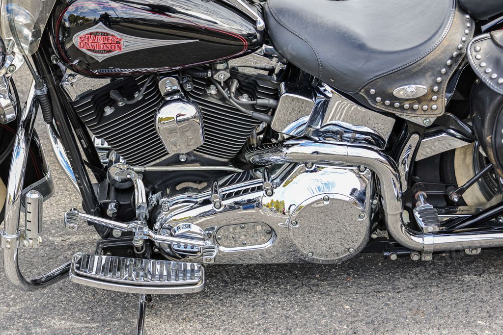 A beautiful chrome Harley Davidson motorcycle parked on display on a road