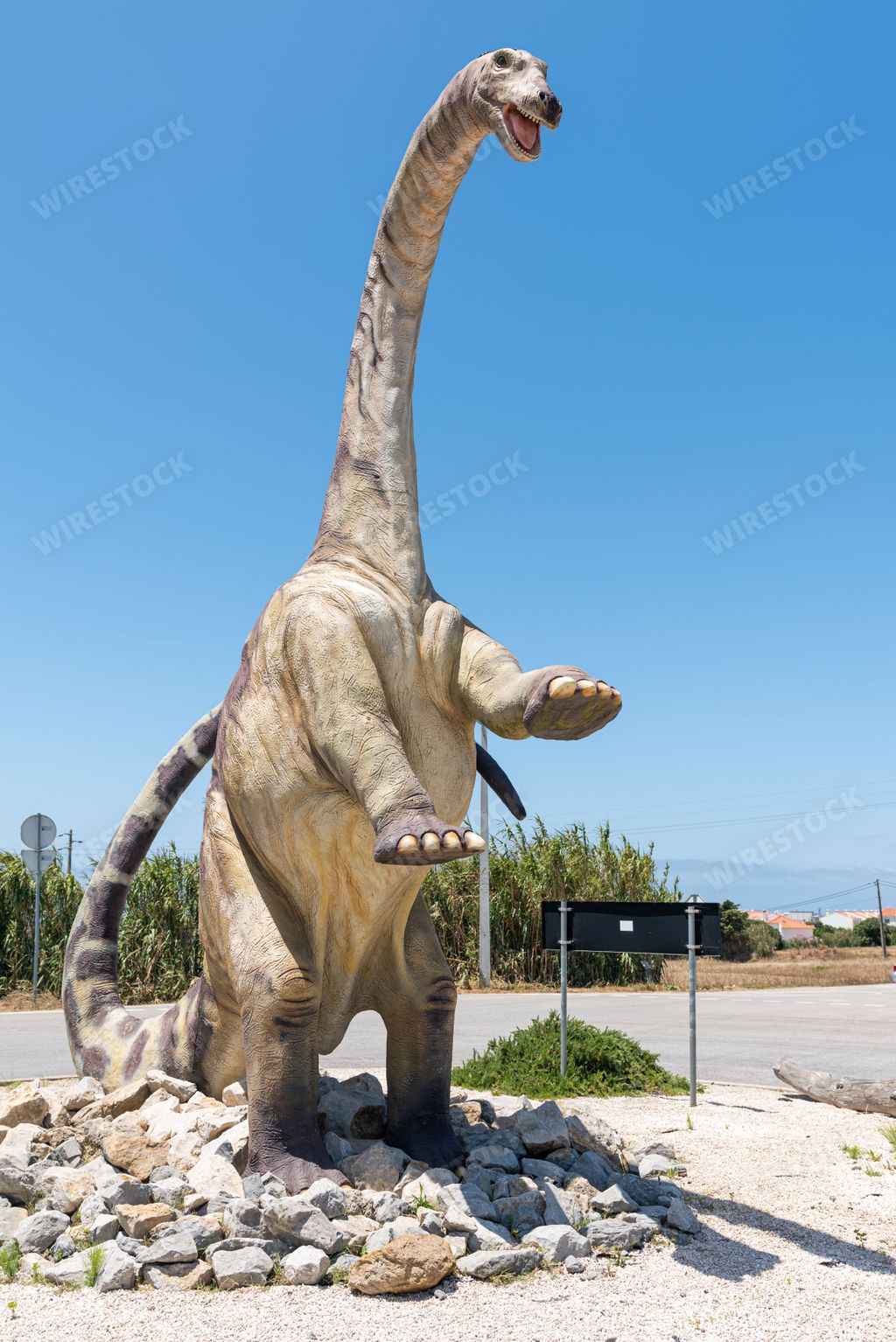 A vertical of a life-size dinosaur in Dino Parque Lourinha, Portugal