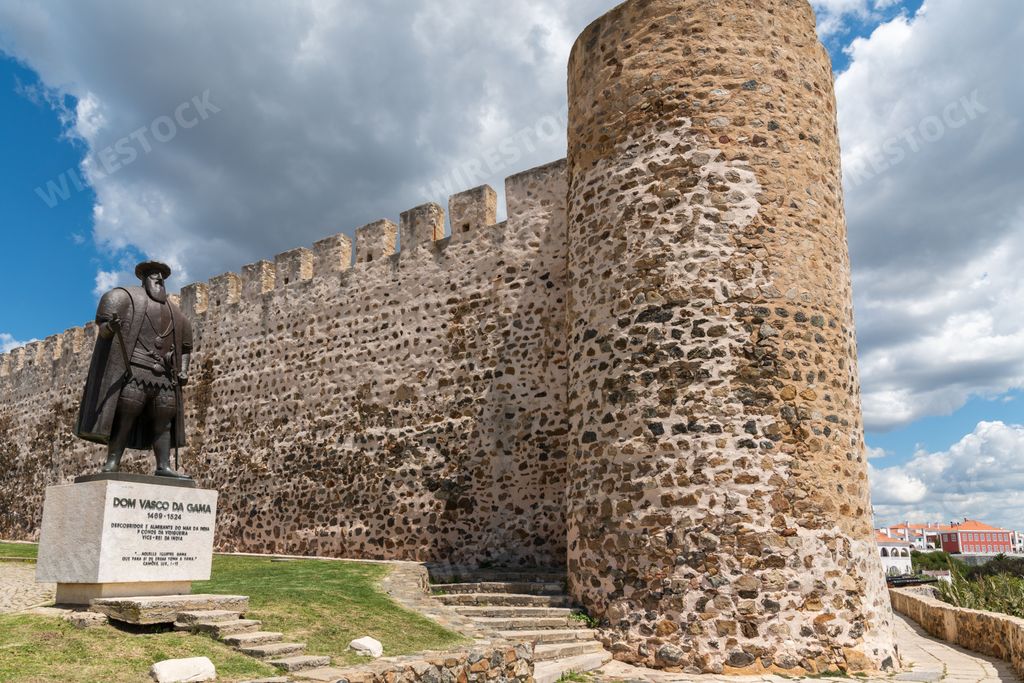 A low angle of the Statue of Vasco da Gama and the Castle of Sines, Portugal