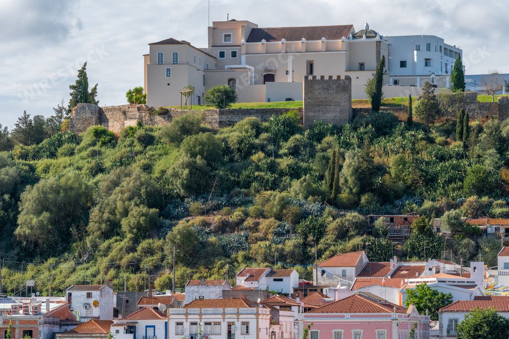 The castle of Alcacer do Sal at the top of the high hill in the town of Alcacer do Sal, Portugal