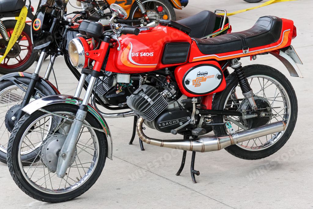A classic SiS Sachs V5 Top Racing motorcycle in red color, parked on the street