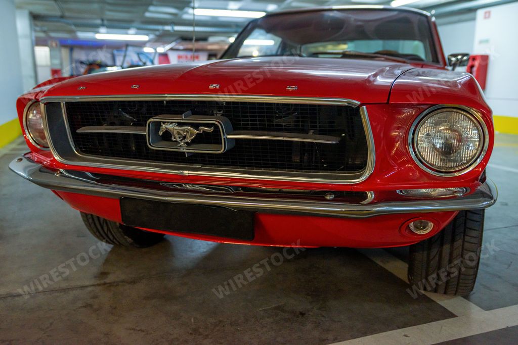 A red car manufactured by Ford model Mustang was presented during 1964-1973 in Torres Novas, Portugal
