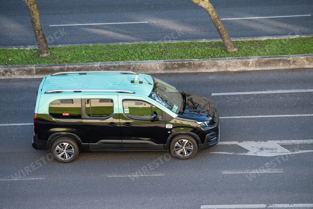 A taxi vehicle transporting passengers in the city of Lisbon, Portugal