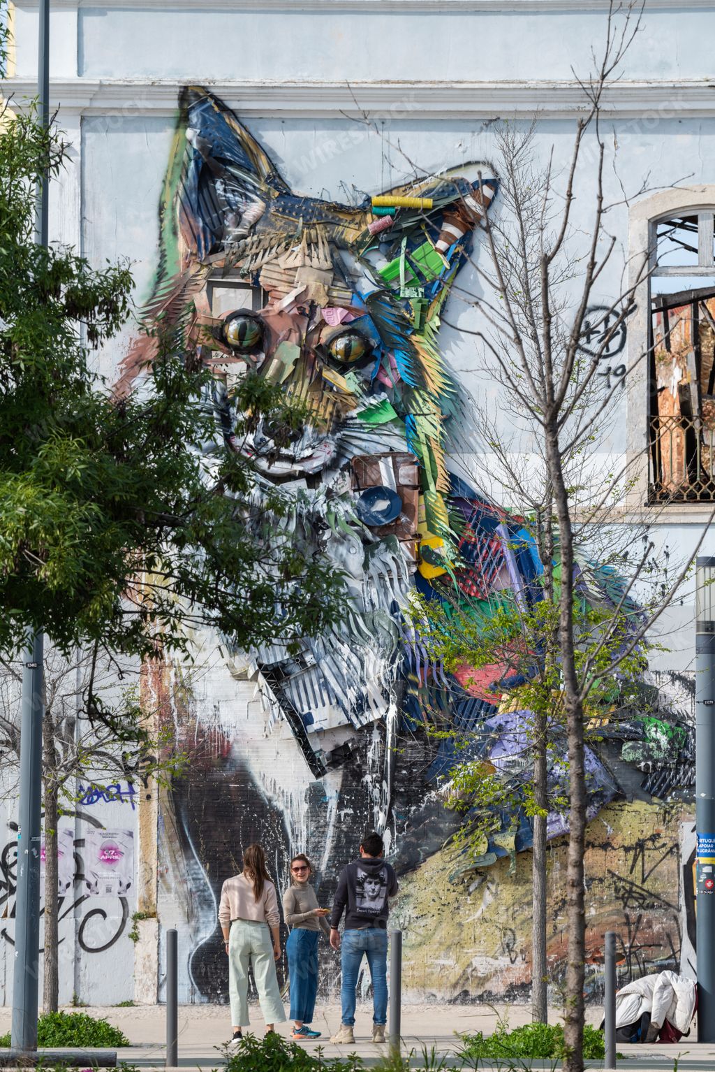 A vertical shot of an urban art mural graffiti of a fox in Lisbon, Portugal