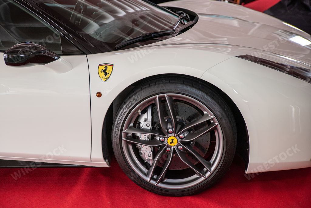 A closeup of a white Ferrari super sports car front detail