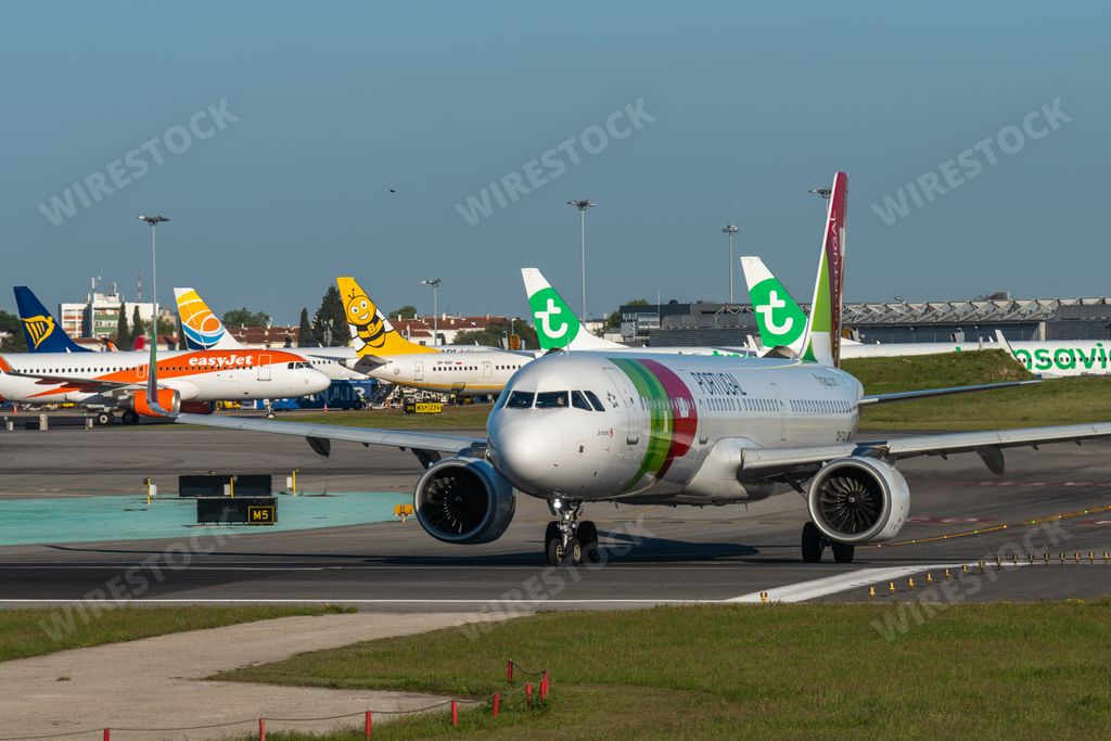 A TAP Air Portugal plane on the runway awaiting orders to take off