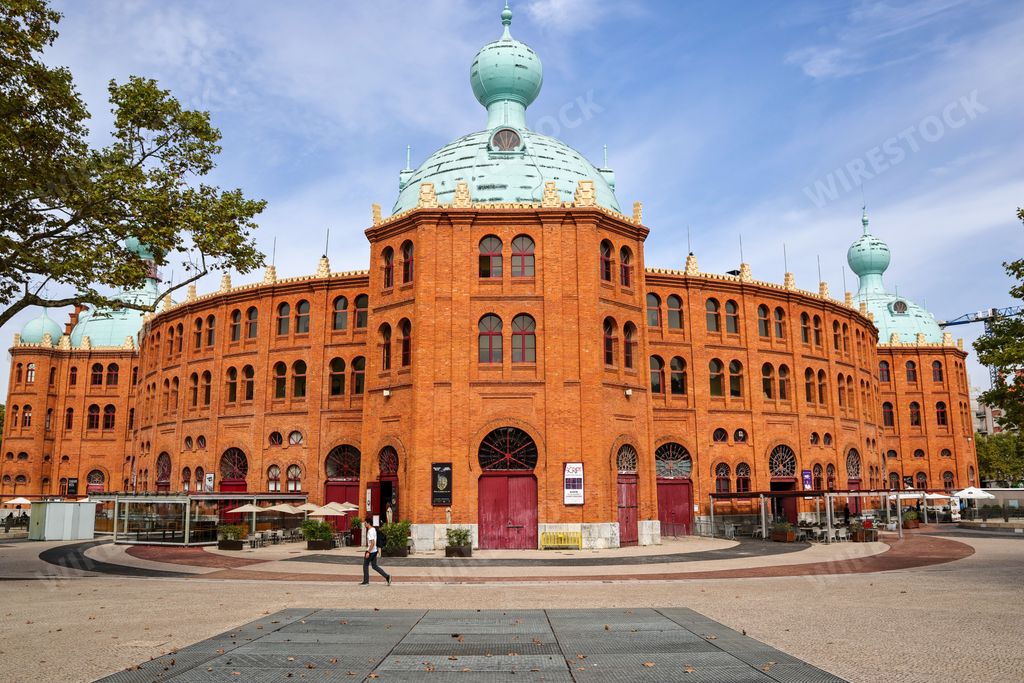 The historic building of Cinema City Campo Pequeno under the blue sky in Lisbon