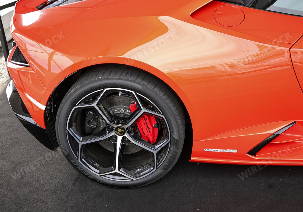 A closeup of the luxurious orange sports car Lamborghini Huracan EVO