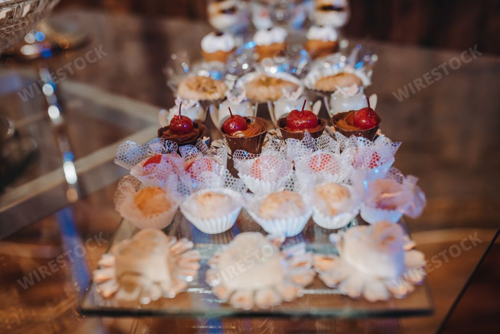 The table full of different appetizing desserts in the restaurant