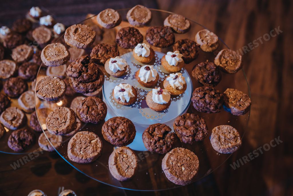 The table full of different appetizing desserts in the restaurant