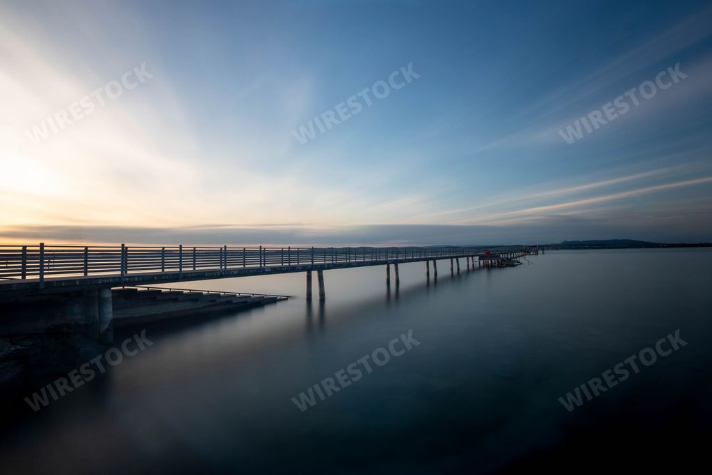 A central European Lake of Constance that borders Germany, Austria and Switzerland in the evening