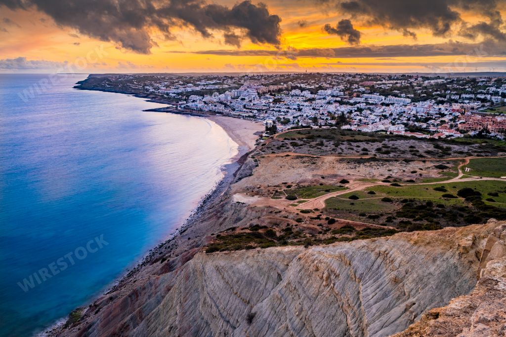 A mesmerizing sunset view of the sea and Lagos, Praia Da Luz in summer