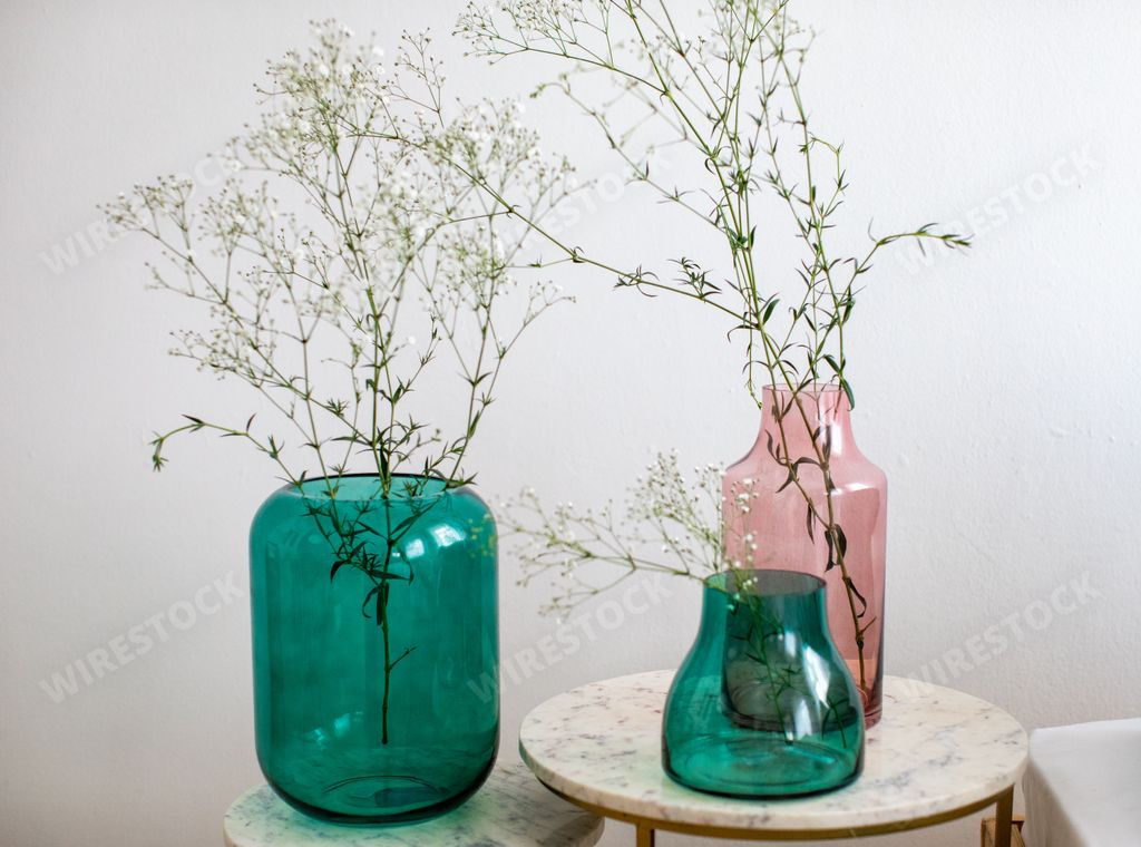 A closeup of modern minimalistic vases with decorative flowers