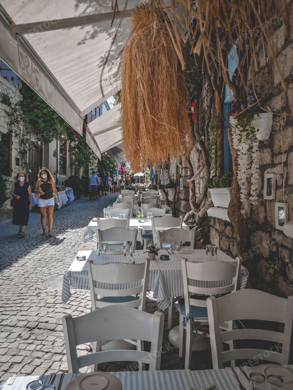 AA beautiful narrow street with outdoors cafe in Izmir, Turkey