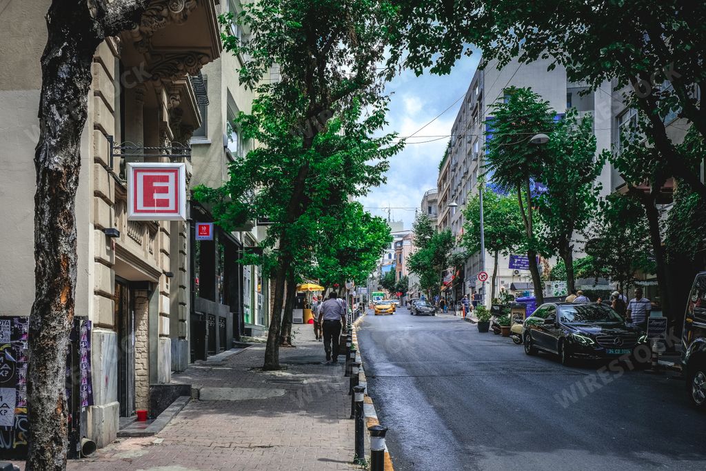 The beautiful streets of Cihangir with trees and people, Istanbul, Turkey