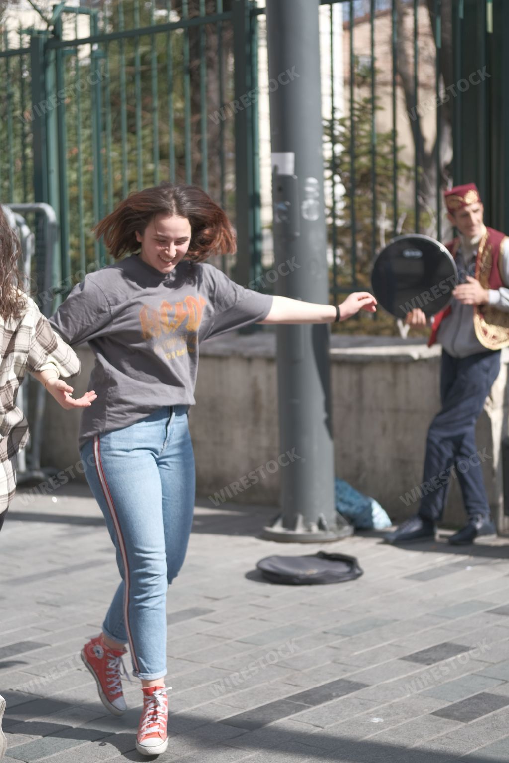 Turkey, Istanbul - Jul 15, 2020 : A blonde young girl is dancing in the street. Summer. Lifestyle.