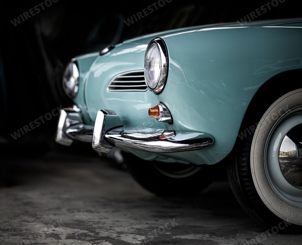 Blue Volkswagen Karmann Ghia in garage
