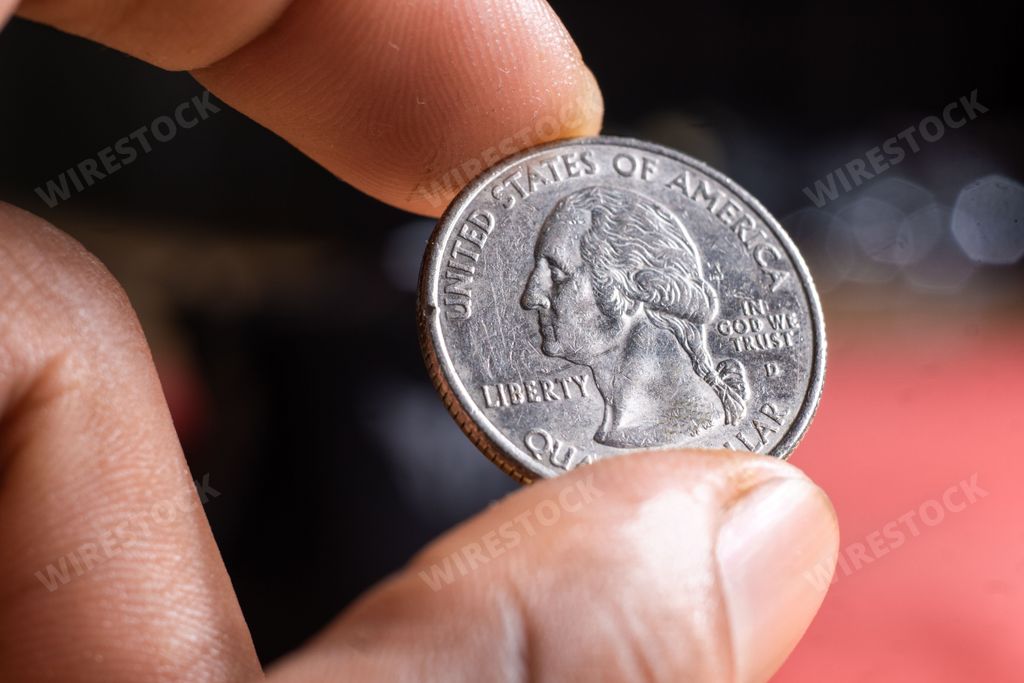 A closeup of  fingers holding an American from the united states
