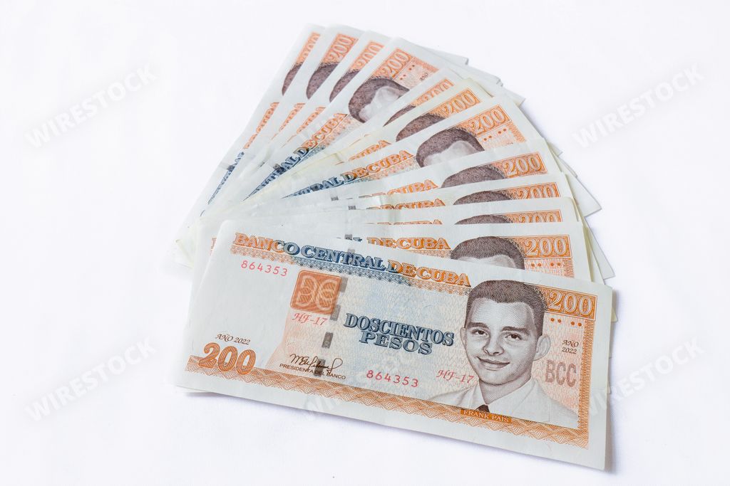 A closeup shot of Cuban 200 peso banknotes on the white table