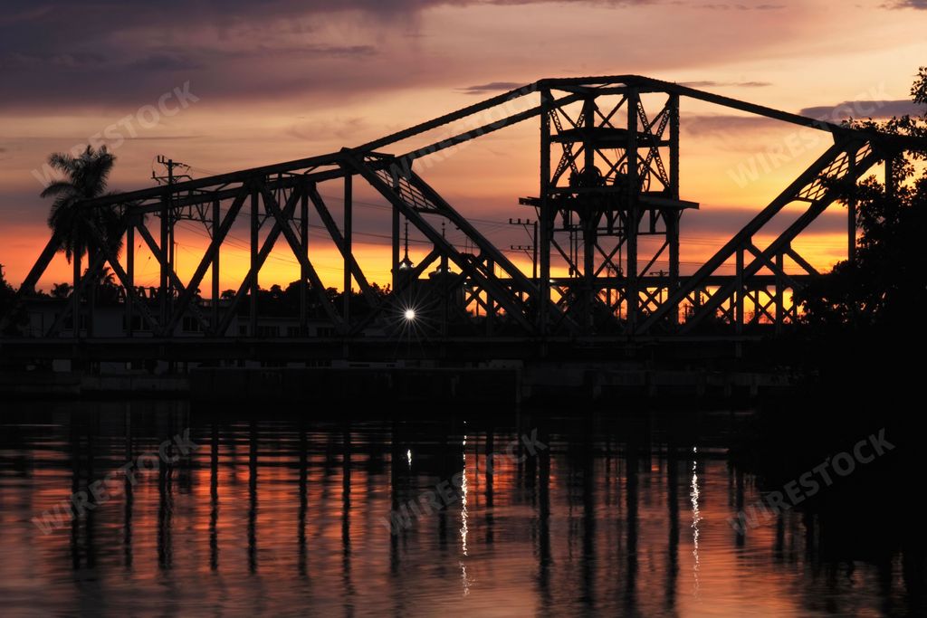 A scenic view of the old rotating bridge in Matanzas, Cuba during sunset