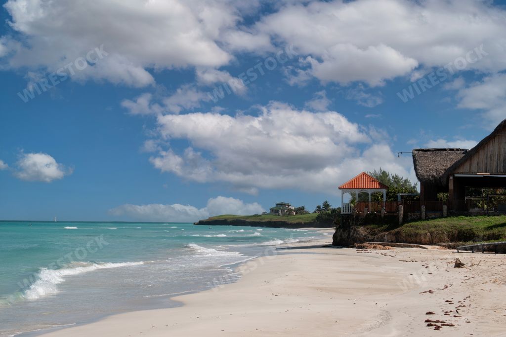 A closeup shot of the blue ocean and buildings on the seaside in Varadero, Cuba