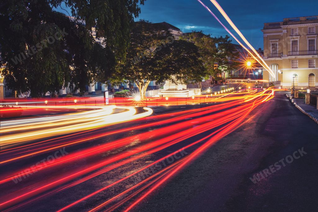 A night shot of car light trails with long exposure on the street