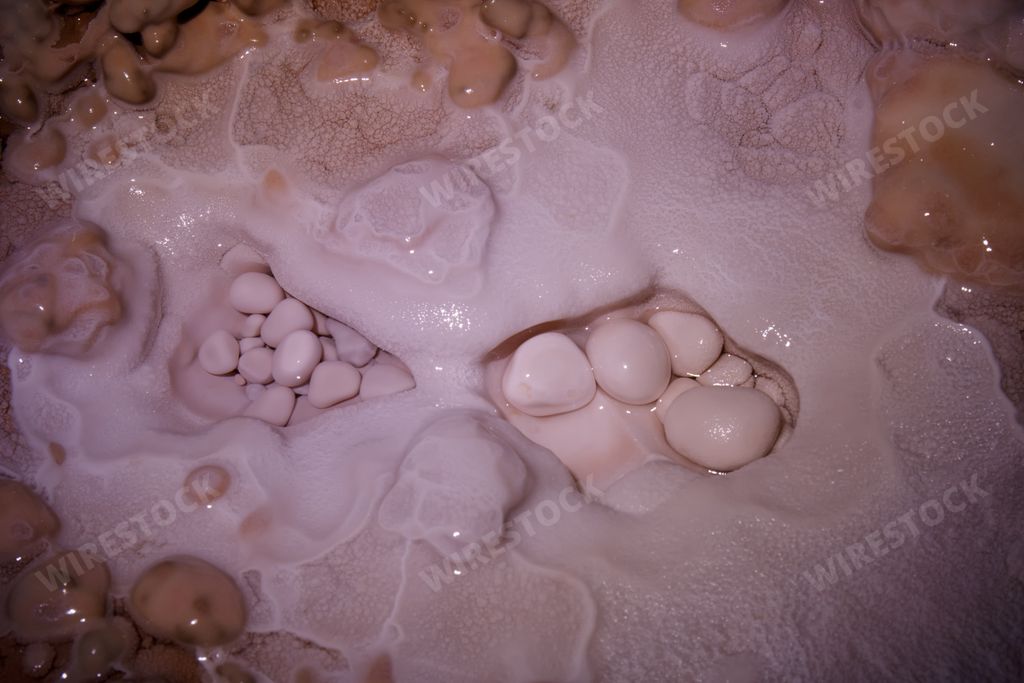 A top view of the white pearls in the dark cave - texture background