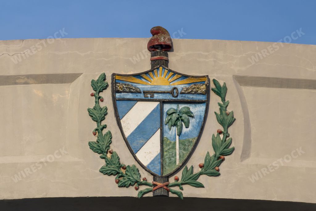 a closeup of Cuba's coat of arms drawn on the wall