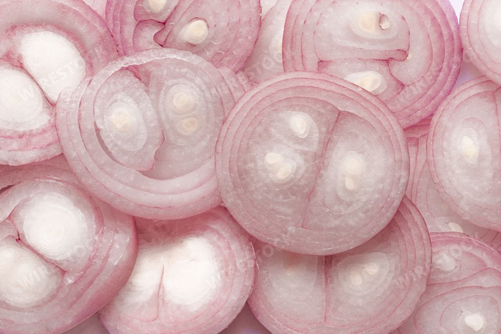 An overhead shot of onions cut in round slices