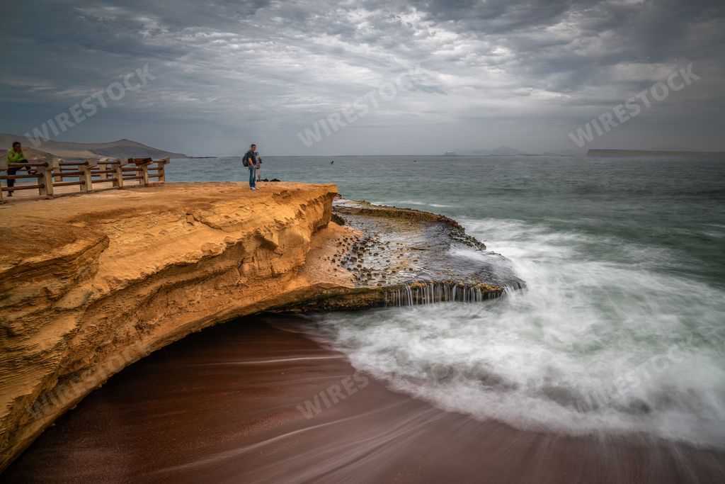 The coast and red sand beach of Paracas National Reserve in Peru