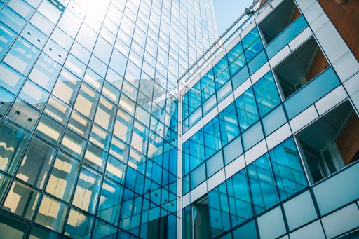 Juan Garcia Fernandez | Low angle shot of a business building with ...