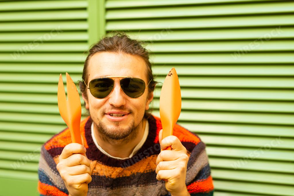 Young caucasian european man with gardening ikea tools