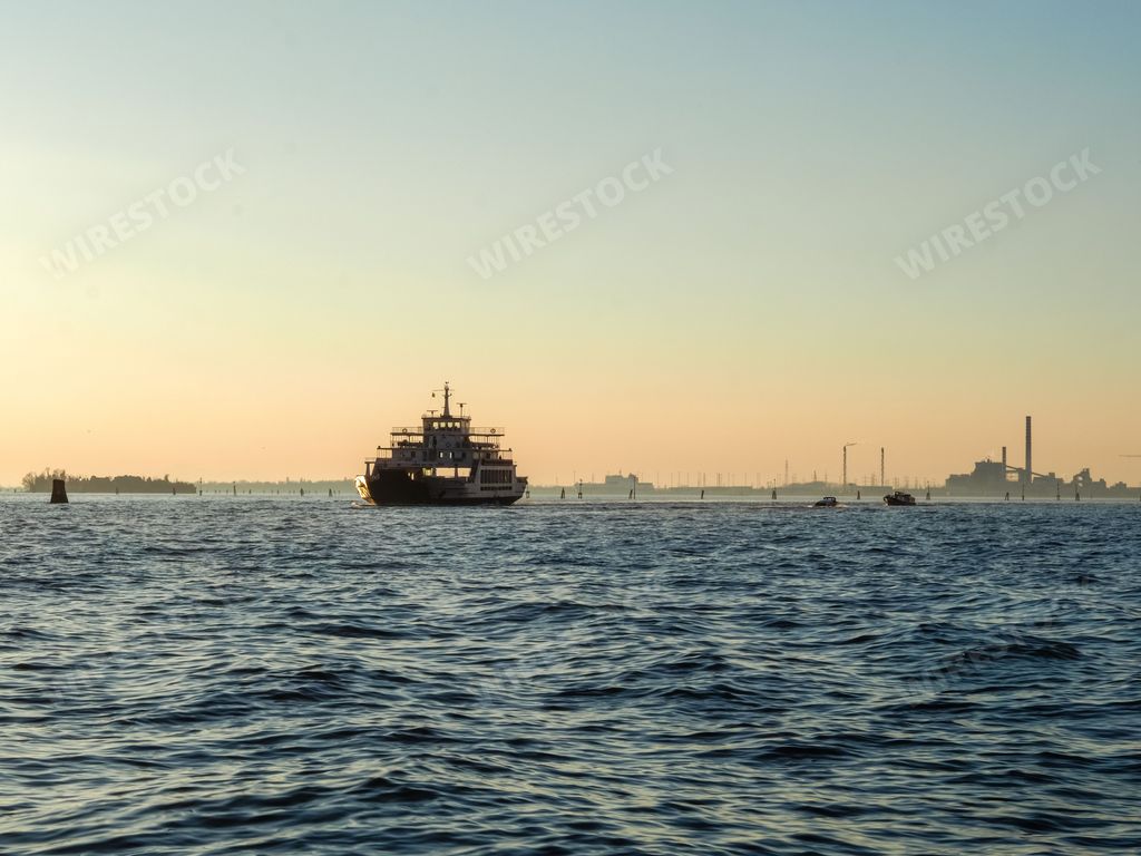 A sea and a boat under the sunlight in Venice, Italy.
