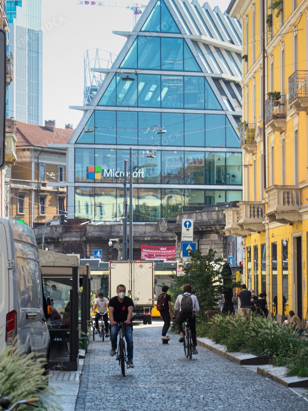 A vertical shot of A Microsoft office and other buildings in Milan,Italy.