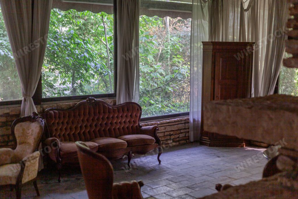 A close-up shot of old vintage interior with soft sofa and beautiful armchairs